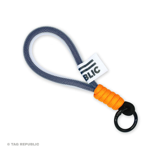 Avaimenperä - punoslenkki, musta-oranssi